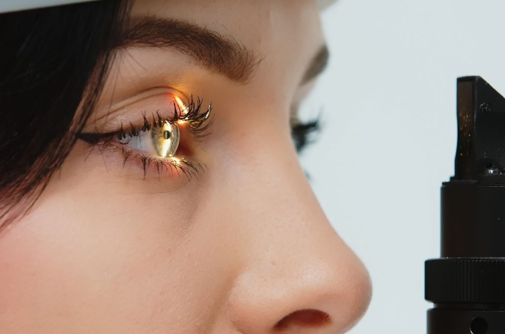 a close-up of a young patient undergoing an eye exam.